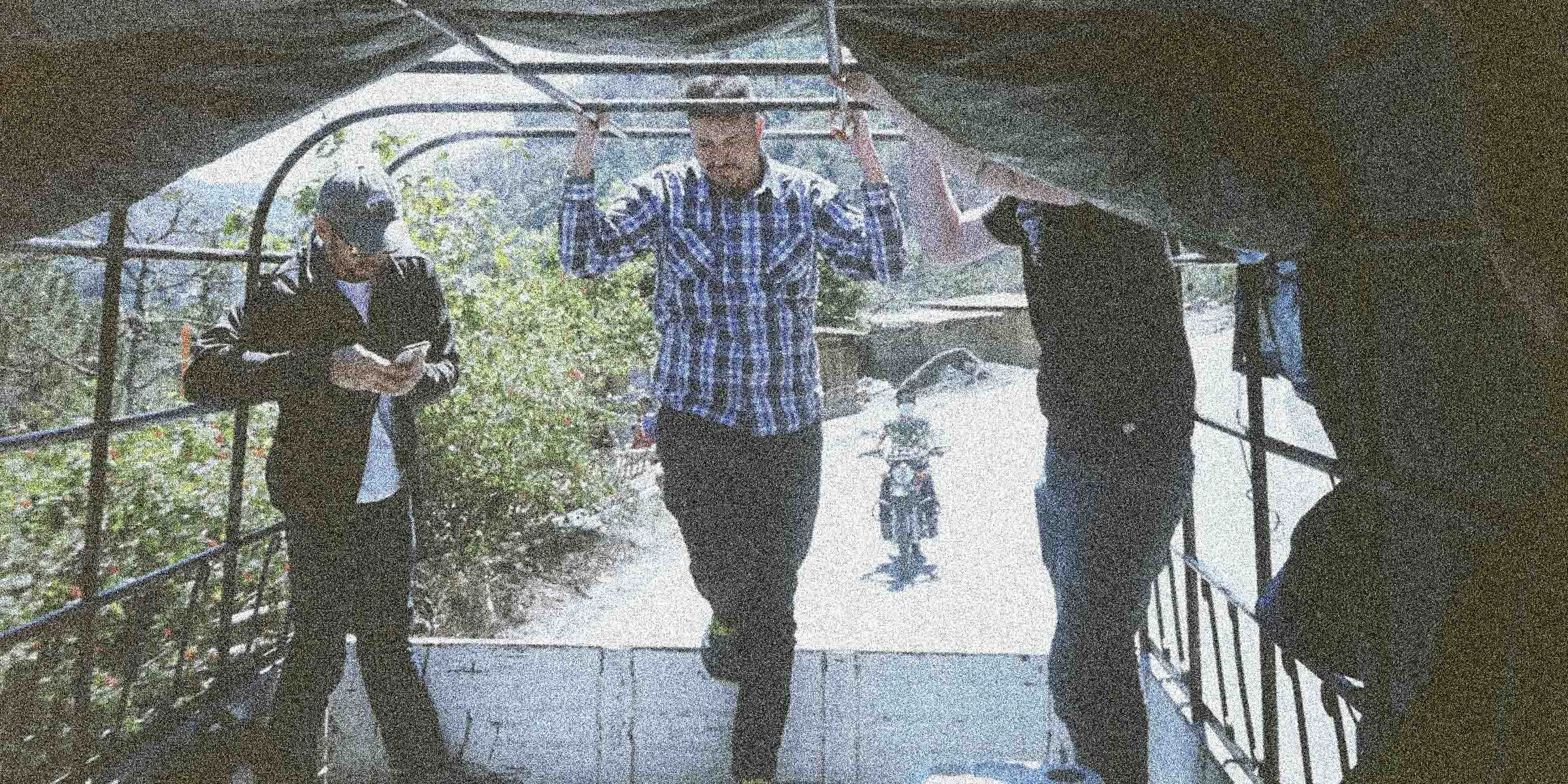 Three guys standing in the back of a truck in Huehuetanango Guatemala