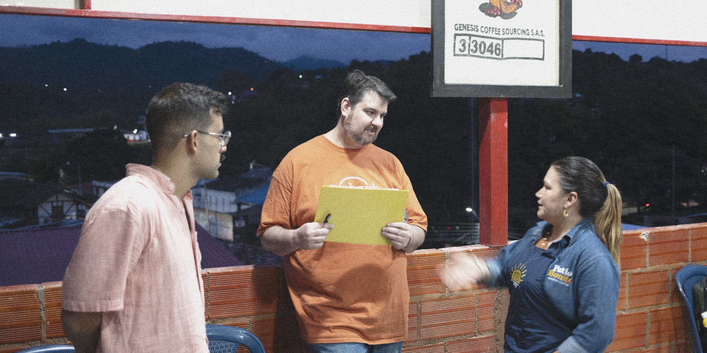 Coffee professionals discussing specialty coffee in rural Colombia