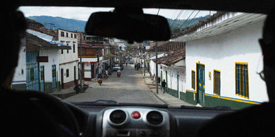 View of a Colombian town from the inside of a car
