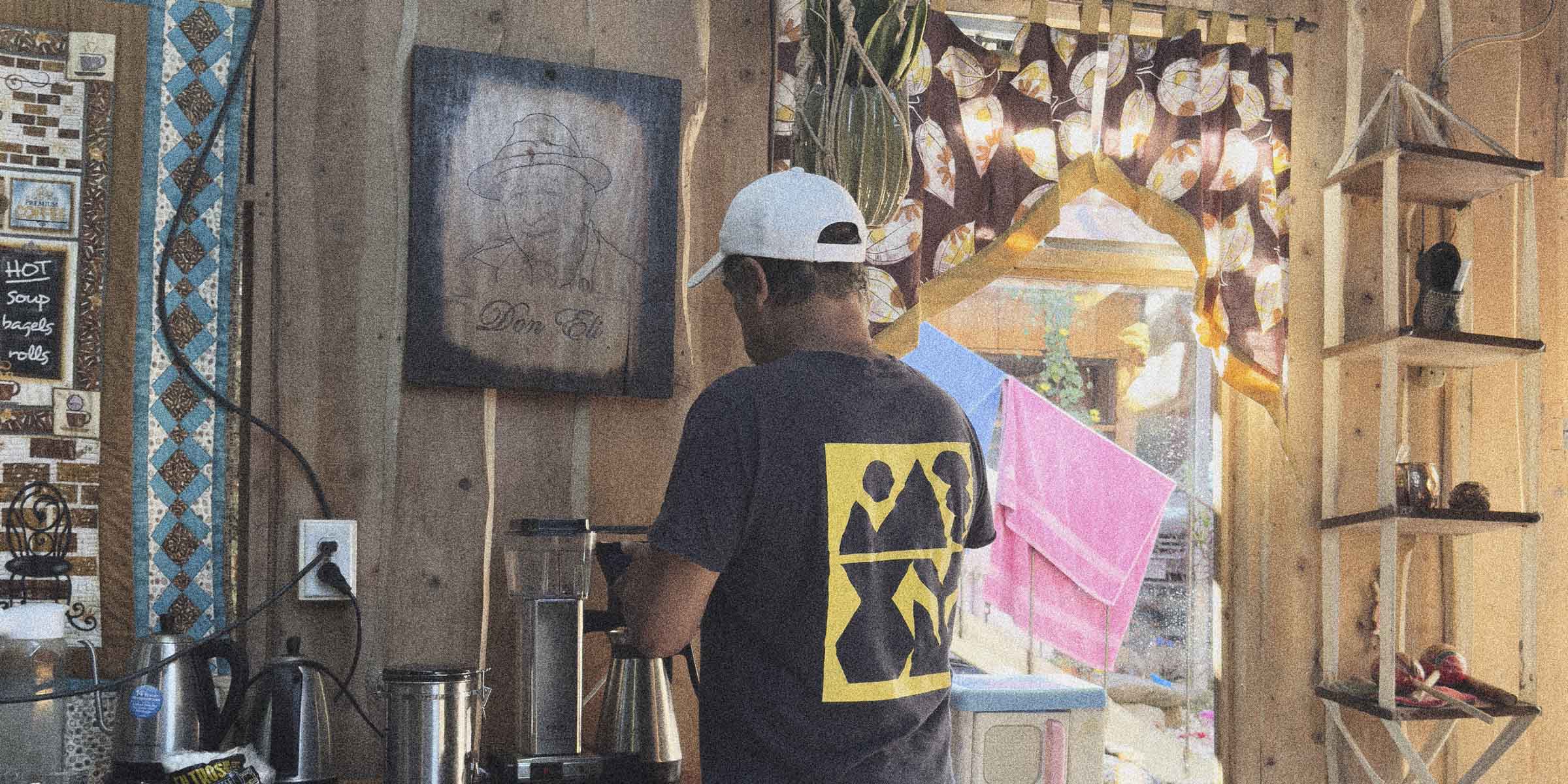 Carlos Montero preparing coffee in his home kitchen