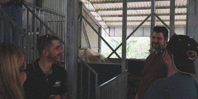 People chatting in a coffee processing facility