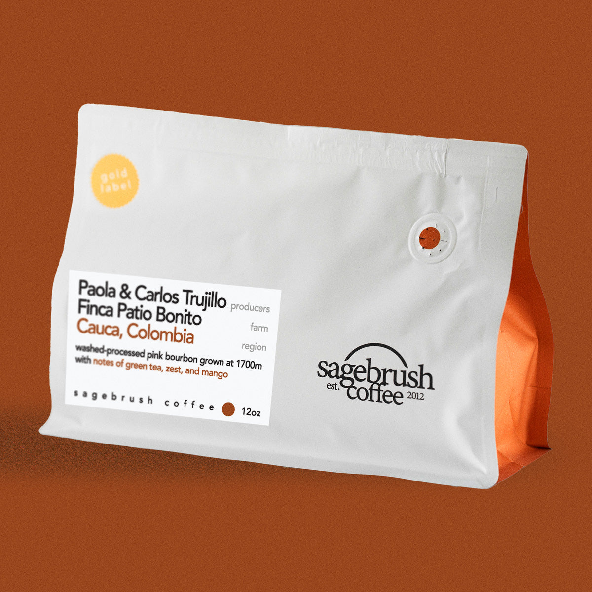 Sagebrush Coffee package of Paola and Carlos Trujillo specialty coffee beans with a dark orange background