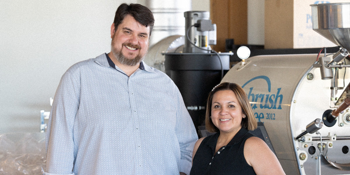 Matt and Anny Ruth standing in the Sagebrush Coffee roastery