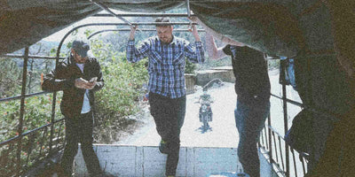 Three guys standing in the back of a truck in Huehuetanango Guatemala
