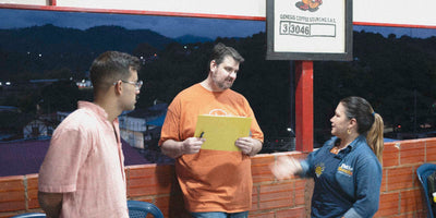 Coffee professionals discussing specialty coffee in rural Colombia