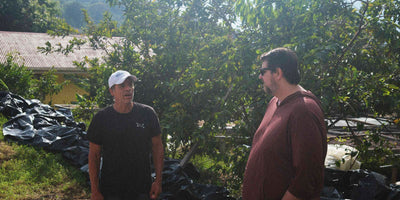 Carlos and Matt chatting on Carlos’s specialty coffee farm