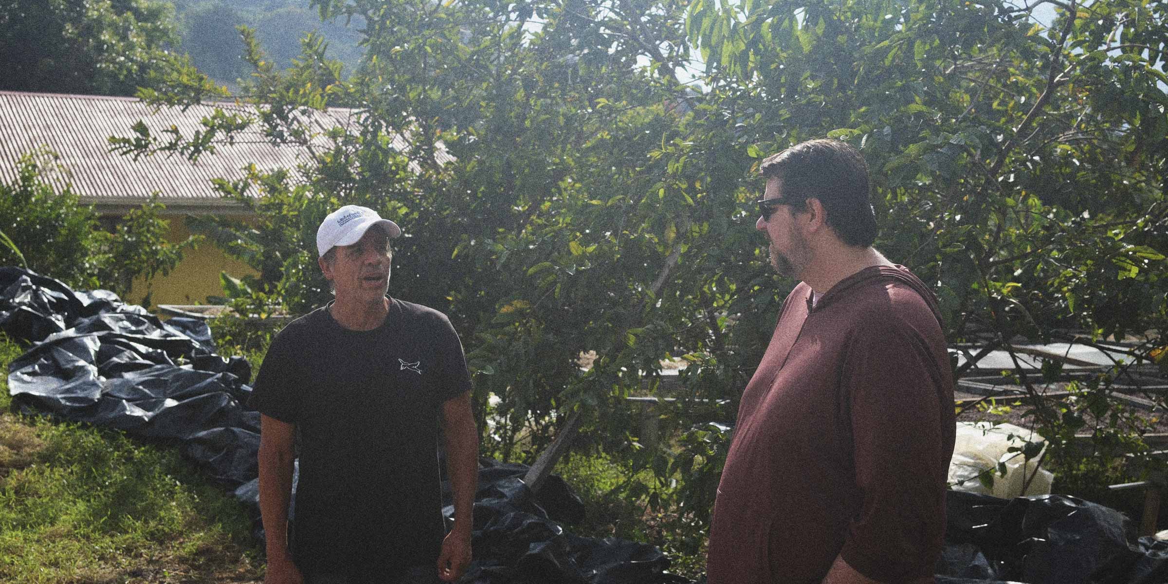 Carlos and Matt chatting on Carlos’s specialty coffee farm