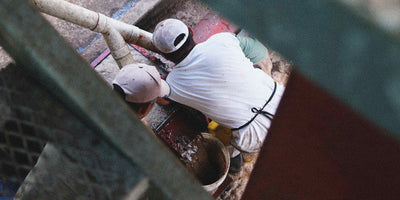 Workers processing coffee cherries