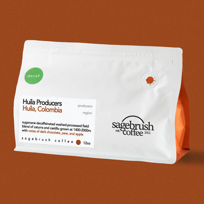 Sagebrush Coffee package of decaf specialty coffee beans with a dark orange background