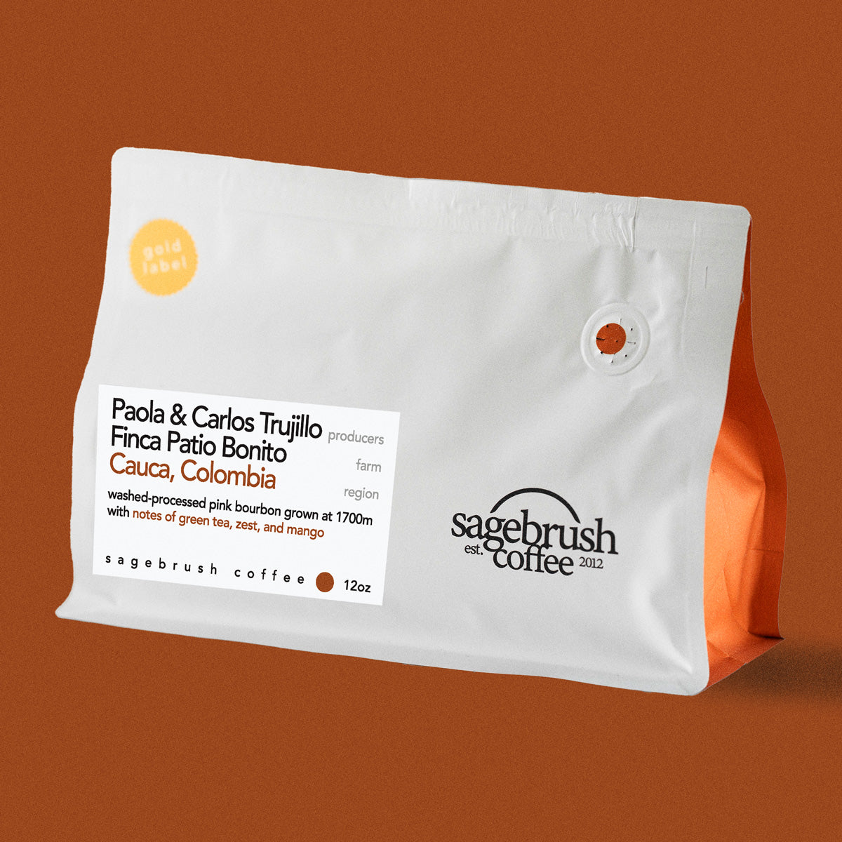 Sagebrush Coffee package of Paola and Carlos Trujillo specialty coffee beans with a dark orange background