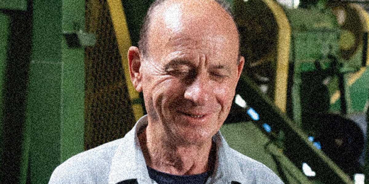 Person in a gray jacket with a blurred background