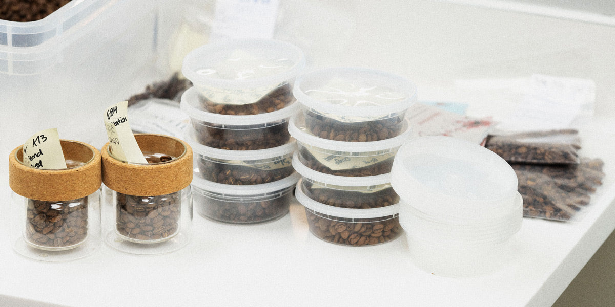 Assorted specialty coffees in containers on a counter in Sagebrush Coffee's cupping lab